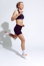 Sport Ideas. Active Caucasian Female Runner Training In Professional Outfit On A Regular Exercise Indoors