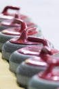 Sport Ideas and Concepts. Closeup of Curling Red Handle Stones