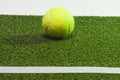 Sport Ideas. Variety of Tennis balls on green artificial grass surface Royalty Free Stock Photo