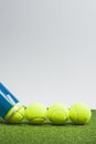 Sport Ideas. Variety of Tennis balls on green artificial grass surface Royalty Free Stock Photo