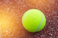 Sport Item concept : Tennis balls in red court. Tennis is racket sport that can be played individually against single opponent
