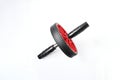 Sport item object, balck and red ab roller wheel on white background with space for text. Essential fitness tool. Home gym