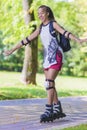 Sport and Lifestyle Concepts. African American Teenager Learning Roller Skating While Balancing with Hands