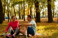 Sport Loving Couple Friends Sitting In Park Royalty Free Stock Photo