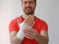 Sport man with bandages medication on his hand