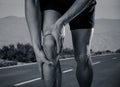 Sport man holding his knee in pain injured when running outdoors Royalty Free Stock Photo