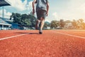 Sport Man jogging and running on track race at Stadium.Sport concept Royalty Free Stock Photo