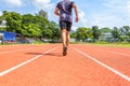 Sport Man jogging and running on track race at Stadium.Sport concept Royalty Free Stock Photo