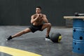 Sport man stretching legs, doing lunge exercise at gym. Workout Royalty Free Stock Photo