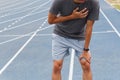 Sport man suffering from chest pain heart attack after running. Healthcare and medical concept Royalty Free Stock Photo