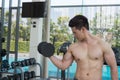 Sport man is working out with dumbbell, exercising working out at fitness Royalty Free Stock Photo