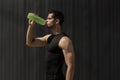 Portrait muscular man taking a break to hydrate his body after training