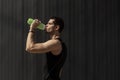 Portrait muscular man taking a break to hydrate his body after Royalty Free Stock Photo