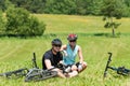 Sport mountain biking couple relax sunny meadows Royalty Free Stock Photo