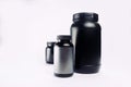 Sport Nutrition, Whey Protein and Gainer. Black Plastic Jars iso Royalty Free Stock Photo