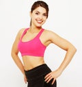 Sport and people concept: Cheerful attractive young fitness woman in top and black leggings Royalty Free Stock Photo