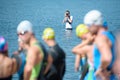 Sport photographer during a photo shoot in water. Shallow depth