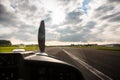 Sport pilot landing on airfield strip