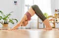 Happy pregnant woman doing yoga at home Royalty Free Stock Photo
