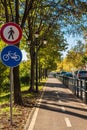 Sport public bicycle and pedestrian track or lanes beside the road Bike lane, bike path sign in summer green park Royalty Free Stock Photo