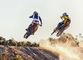 Sport, racer and dirtbike in action for competition on dirt road with performance, challenge and adventure. Motocross