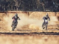 Sport, racer and motorbike in action for competition on dirt road with performance, challenge and adventure. Motocross