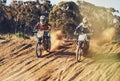 Sport, racer and motorcycle in action for challenge on dirt road with performance, competition and adventure. Motocross