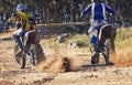Sport, racer and motorcycle in action for competition on dirt road with performance, challenge and adventure. Travel