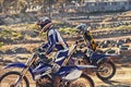 Sport, racer and motorcycle on track for competition on dirt road with performance, challenge and adventure. Motocross