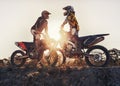 Sport, racer or people on motorcycle outdoor on dirt road with relax after driving, challenge or competition. Sunrise
