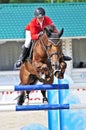 Sport. Rider with horse jumps over a hurdle