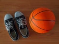 Sport shoes and basketball ball. Royalty Free Stock Photo