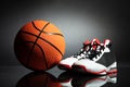 Sport Shoes And Basketball On Desk Royalty Free Stock Photo