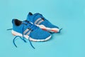 Sport shoes on blue background Royalty Free Stock Photo