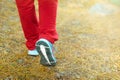 Sport shoes on woman leg close up on road Royalty Free Stock Photo