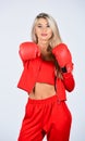 Sport and sportswear fashion. girl in boxing gloves punching. training with coach. fight for success. knockout and