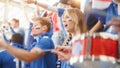 Sport Stadium Big Event Tribune: Crowd of Real Fans Cheer for their Blue Soccer Team that Loses Royalty Free Stock Photo