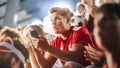 Sport Stadium Event: Handsome Caucasian Man Cheering. Crowd of Fans with Painted Faces Shout for Royalty Free Stock Photo