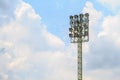 Sport stadium floodlights on a cloudy background.