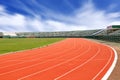 Sport stadium with running track lines blue sky background. Royalty Free Stock Photo