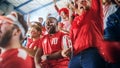 Sport Stadium Soccer Match: Diverse Crowd of Fans Cheer for their Red Team to Win. People Celebrate Royalty Free Stock Photo