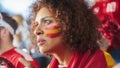 Sport Stadium Soccer Match: Portrait of Beautiful Bi Racial Fan Girl with Spanish Flag Painted Face Royalty Free Stock Photo