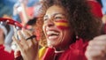 Sport Stadium Soccer Match: Portrait of Beautiful Bi Racial Fan Girl with Spanish Flag Painted Face Royalty Free Stock Photo