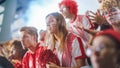 Sport Stadium Sport Event: Beautiful Cheering Girl. Crowd of Fans with Painted Faces Cheer, Shout Royalty Free Stock Photo