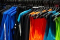 Sport store rack with sleeveless t-shirts and shirts