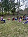 Sport Students sitting on the grass for sport class Royalty Free Stock Photo