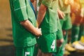 Sport Success and Winning Concept. Close-up of Young Sports Team Standing in Row with Golden Medals