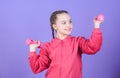 Sport success. workout of small girl hold dumbbell. weight lifting for muscules. Sport activity. Fitness diet for energy