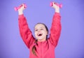 Sport success. workout of small girl hold dumbbell. weight lifting for muscules. Childhood activity. Fitness diet for