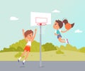 Sport summer camp, children play basketball fun game, jump high to throw ball into basket Royalty Free Stock Photo